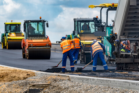 infrastructure workers at work on a highway