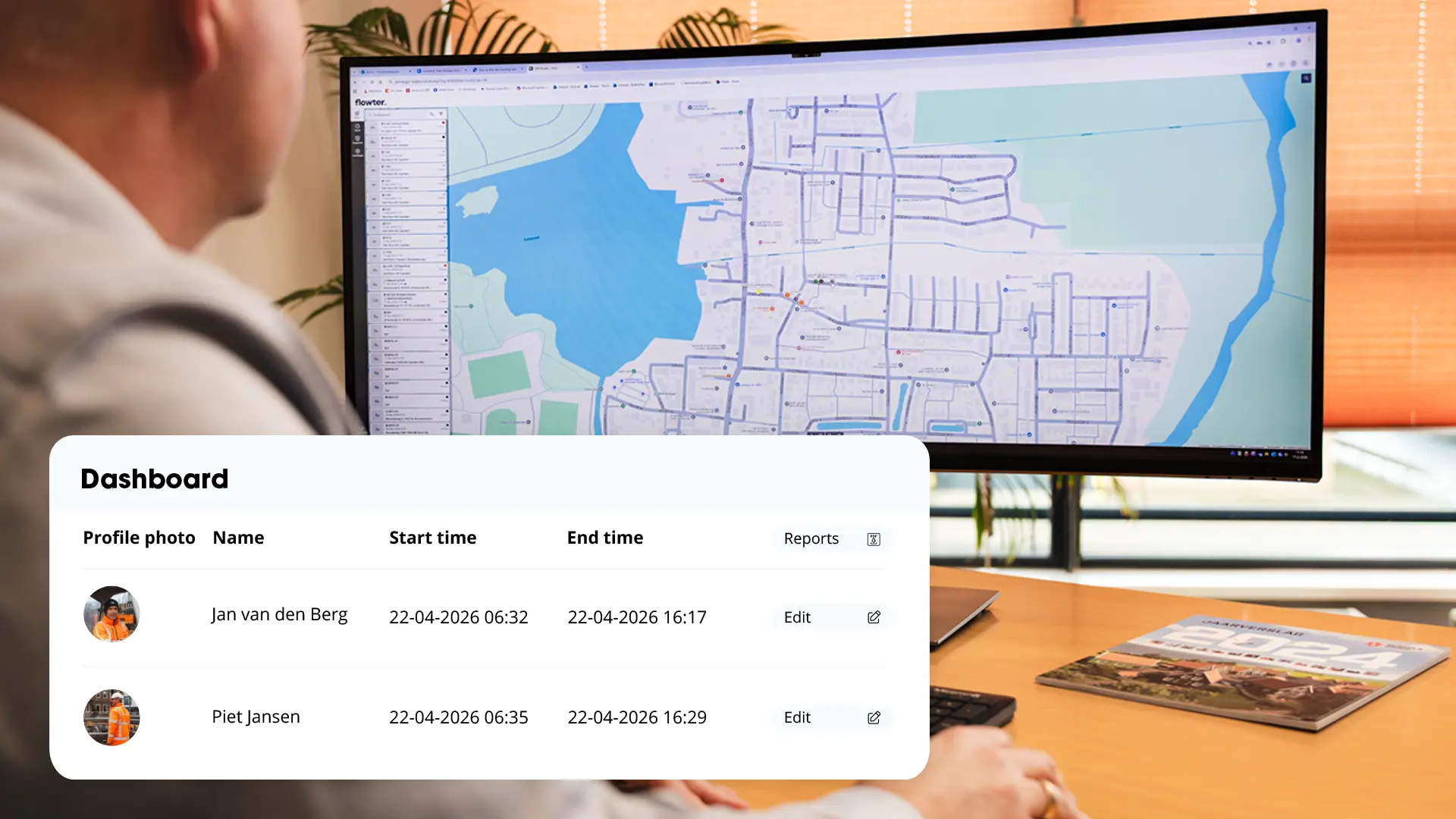 Man in an office looking at a widescreen monitor showing a map with location data, with a dashboard in the foreground listing employees Jan van den Berg and Piet Jansen, their start and end times, and a button to edit reports.