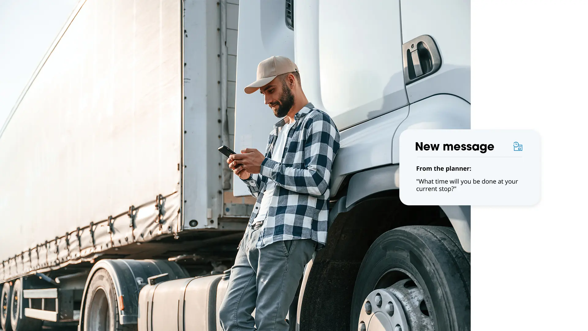 Driver leaning against truck looking at phone, with a message card from the planner