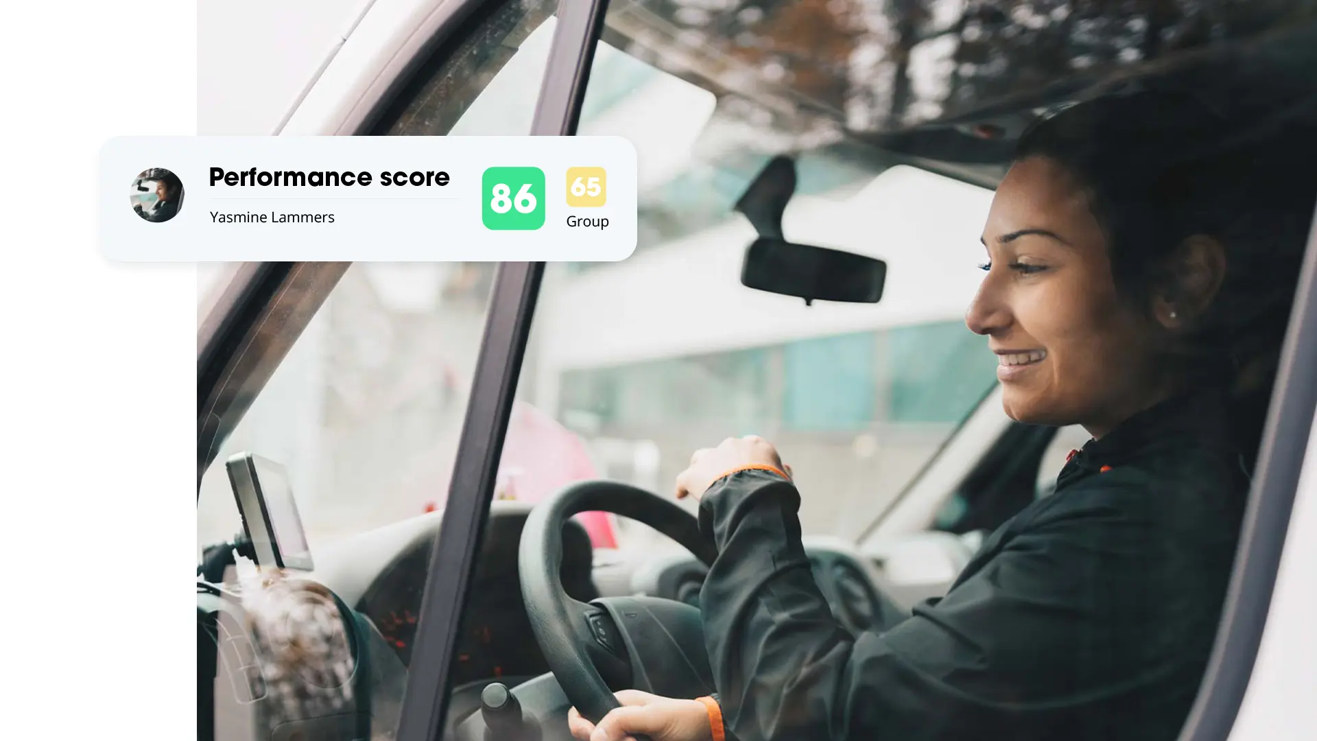 Smiling woman driving a van, with a card showing driver Yasmine Lammers' performance score (86) and her group score (65).